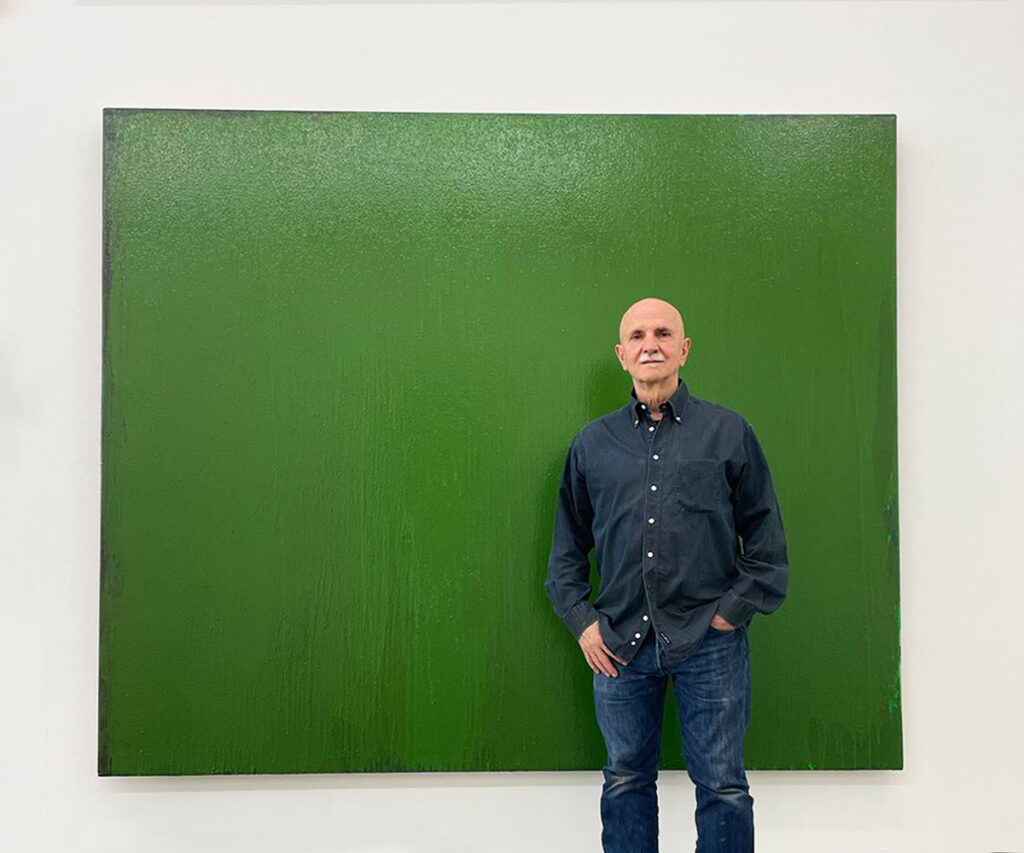 Josesph Marioni in front of green painting. Photo by Barbara Breitsprecher.